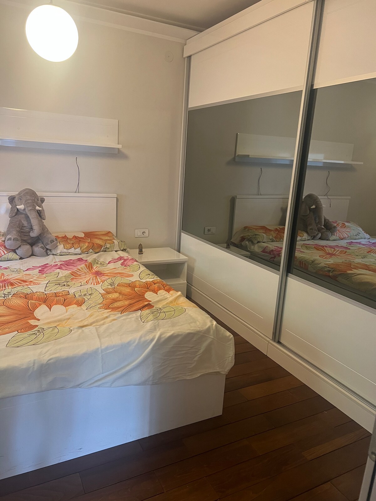 Bedroom with a double bed and mirrored wardrobe