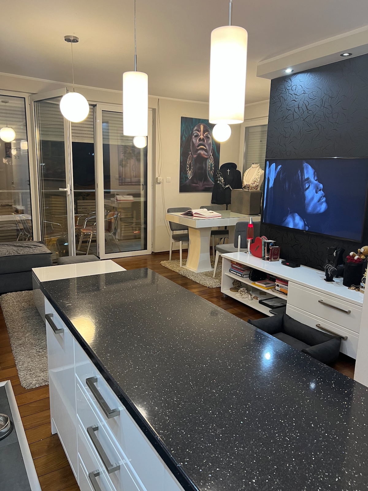 Kitchen island and sink with the living room beyond